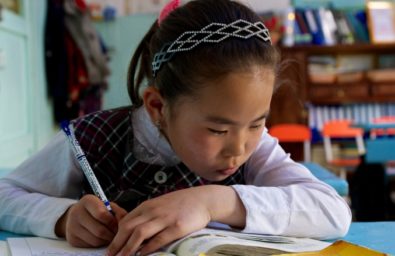 Young girl studying With rapid growth, the Government of Mongolia introduced a number of programs to improve the country’s education system, especially rural primary education. Murun County, Mongolia. Photo: Khasar Sandag / World Bank